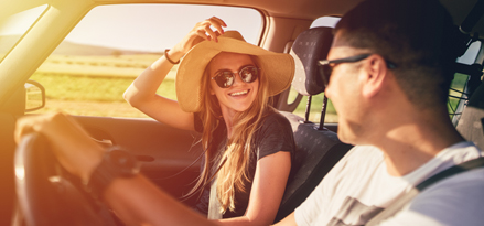 Couple inside a car enjoying the ride