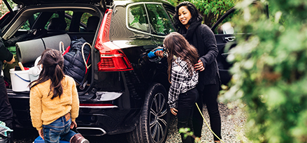 family enjoying nature with their electric vehicle