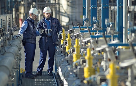 Industrial plant with two men