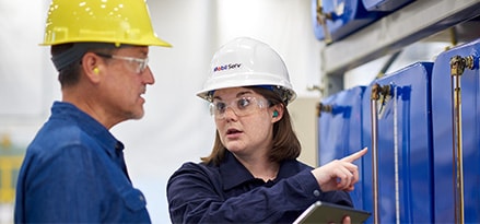 Engineers with hard hats discussing