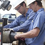 Two engineers working in factory