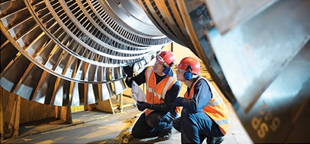 Engineers working on turbine