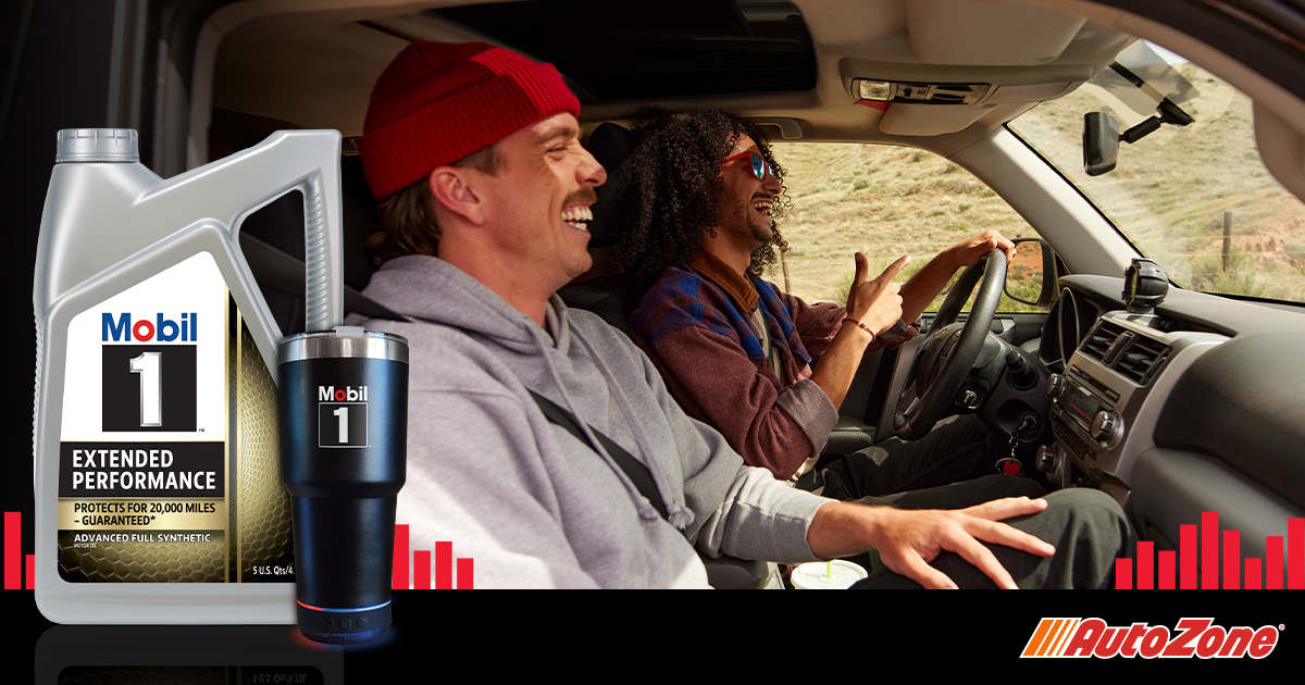 Two guys laughing while driving a car. Mobil 1 Extended Performance and Mobil 1 branded drink tumbler in the foreground.