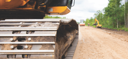 Construction equipment on a dirt road