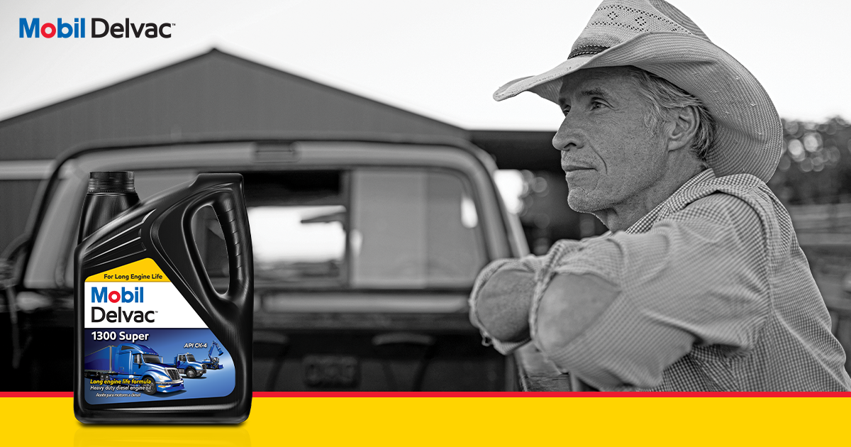 Hardworking rancher in a straw cowboy hat leaning against the back of a pickup truck Mobil Delvac 1300 product shot on left.