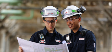 construction workers reading blueprint