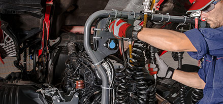 Technician working on fleet truck