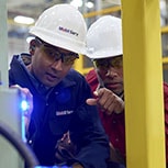 Engineers inspecting with light