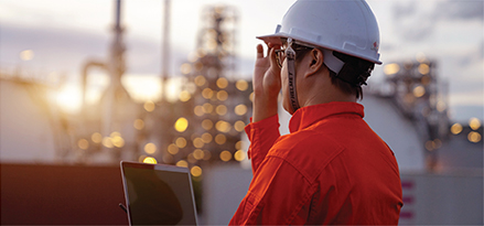 Worker with hard hat at industrial facility